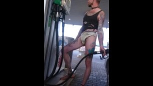 Exibitionist Tattooed Man Shows his Hot Body while Fueling