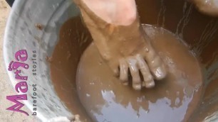Maria Bare Feet in a Bucket of Liquid Mud