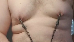 Fatty edging his little cock with nipple clamps on