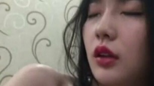 Chinese girl strips, plays with herself and then gets fucked