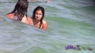 Two Italian girls playing under the water on the topless beach